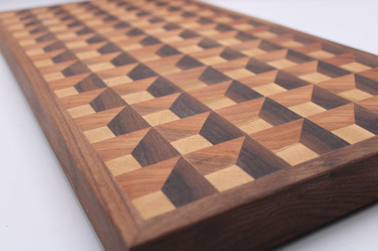 Wooden cutting board with a 3-D geometric pattern on a white background