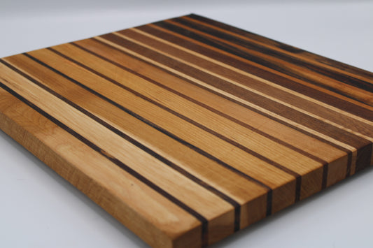 Wooden cutting board with striped pattern on a white background