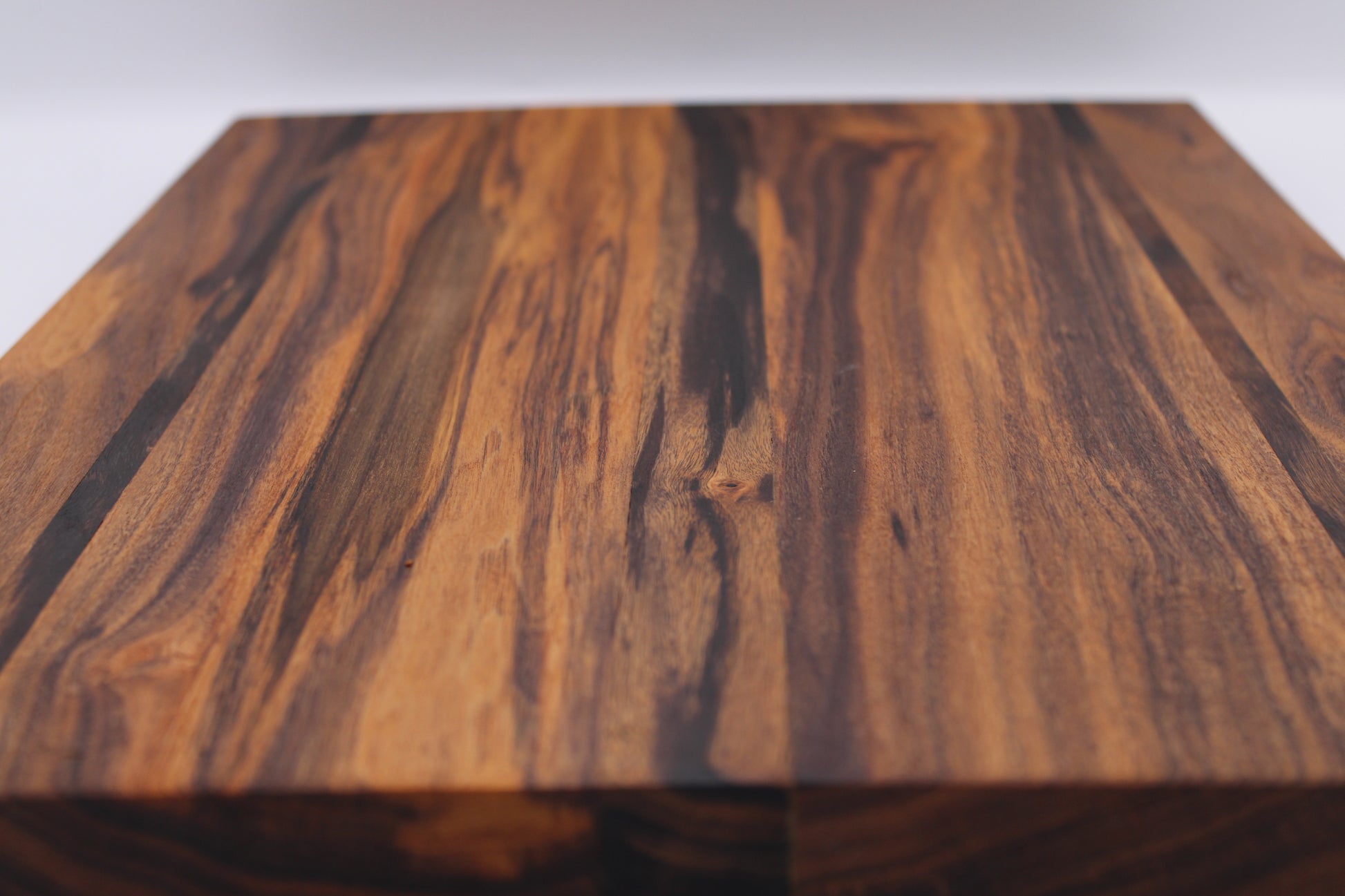 Close-up of a wooden surface with visible grain and texture.