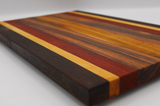 Wooden cutting board with striped pattern on a white background