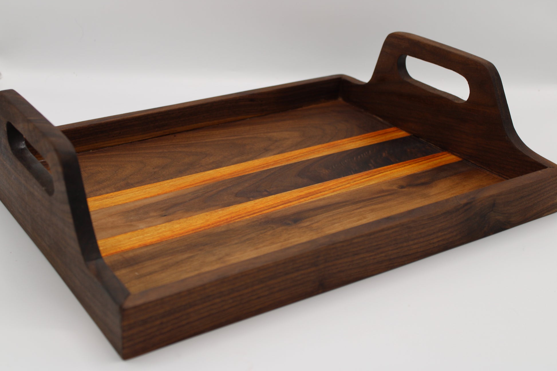 Wooden tray with handles on a white background