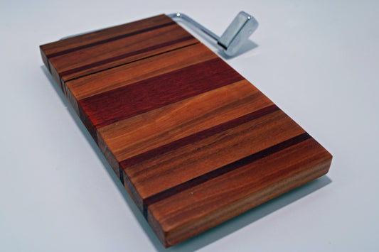 Wooden cutting board with a metal handle on a white background