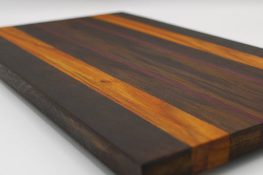 Wooden cutting board with striped pattern on a white background
