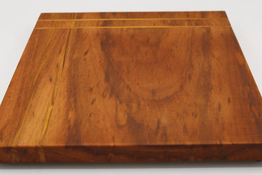 Wood cutting board with inlaid stripes