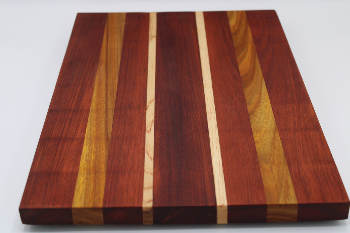Wooden cutting board with striped pattern on a white background