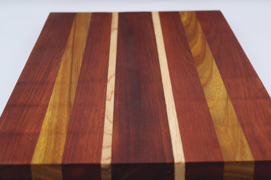 Wooden cutting board with a striped pattern on a white background