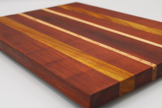 Wooden cutting board with striped pattern on a white background