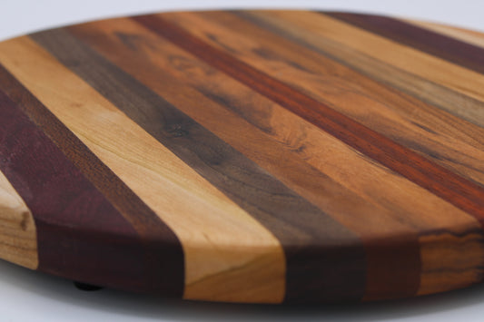 Round wood cutting board will multi color stripes