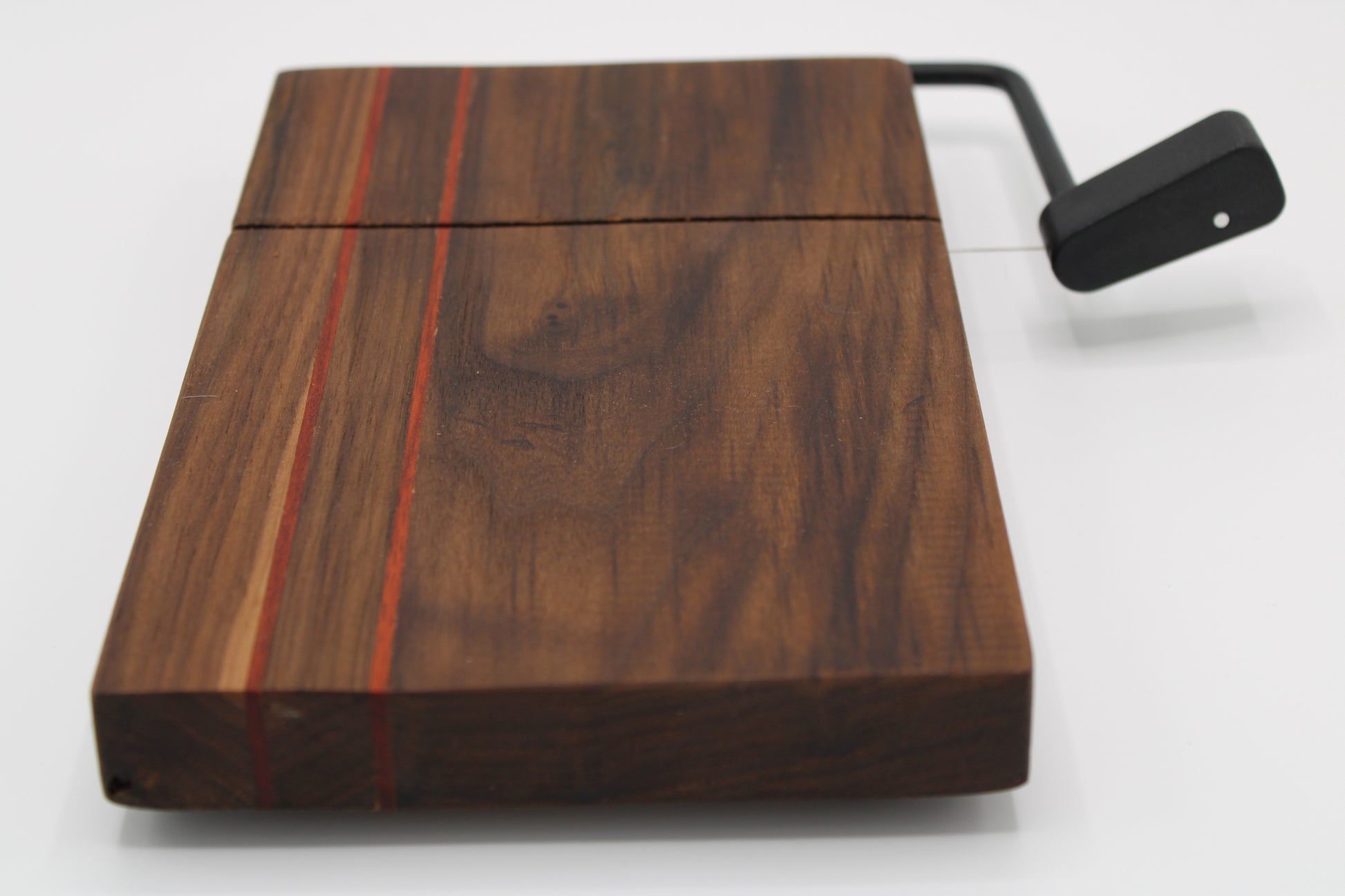 Wooden cheese board with cutter