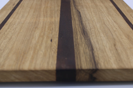 Wood cutting board with light and dark brown stripes