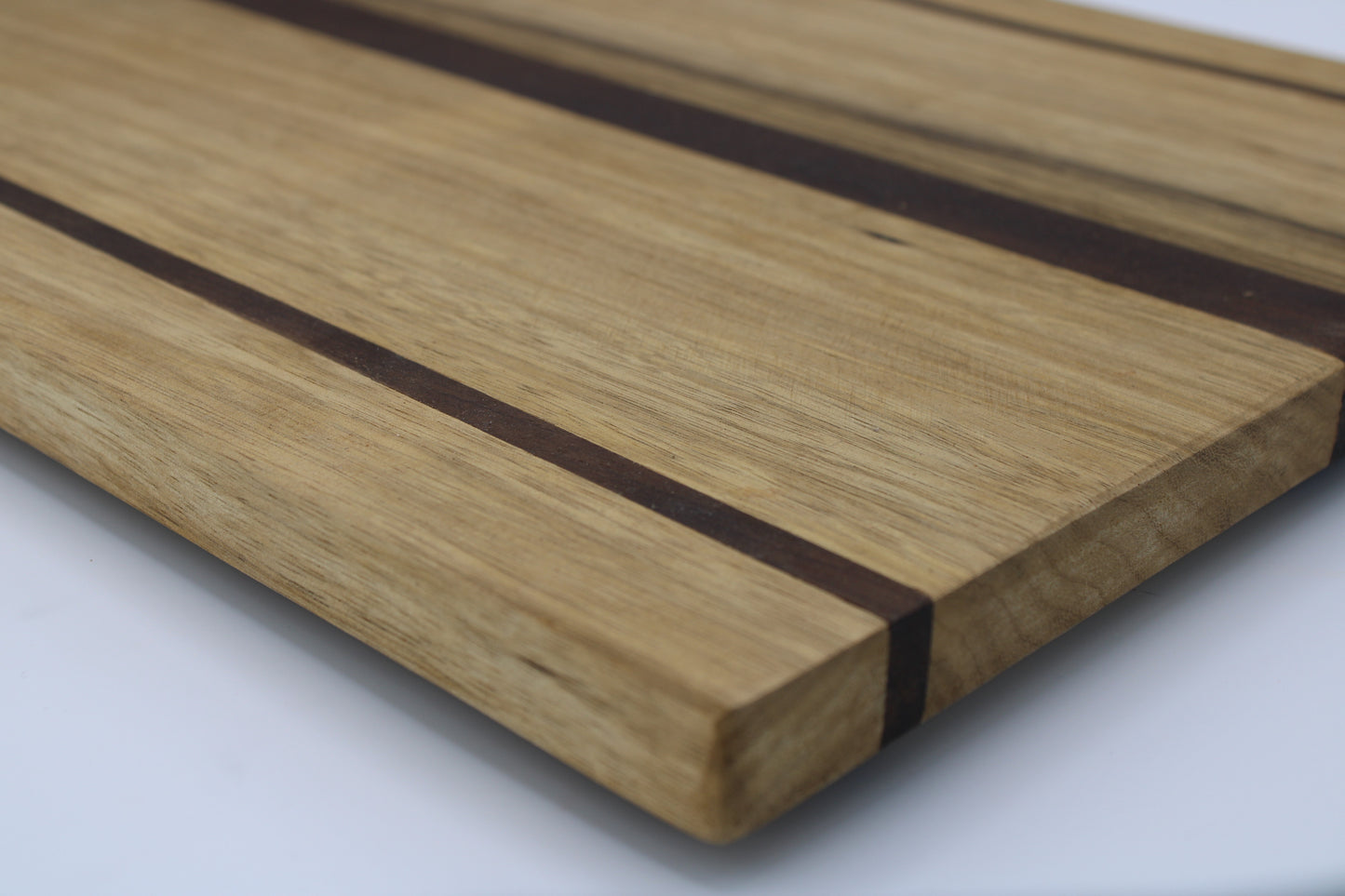 Wood cutting board with light and dark brown stripes