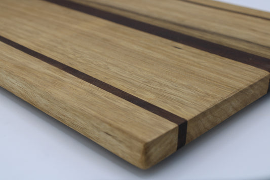 Wood cutting board with light and dark brown stripes