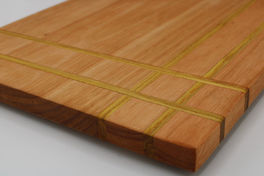 Wood cutting board with corner weave detail