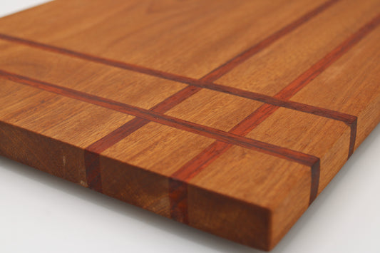 Wood cutting board with corner weave detail