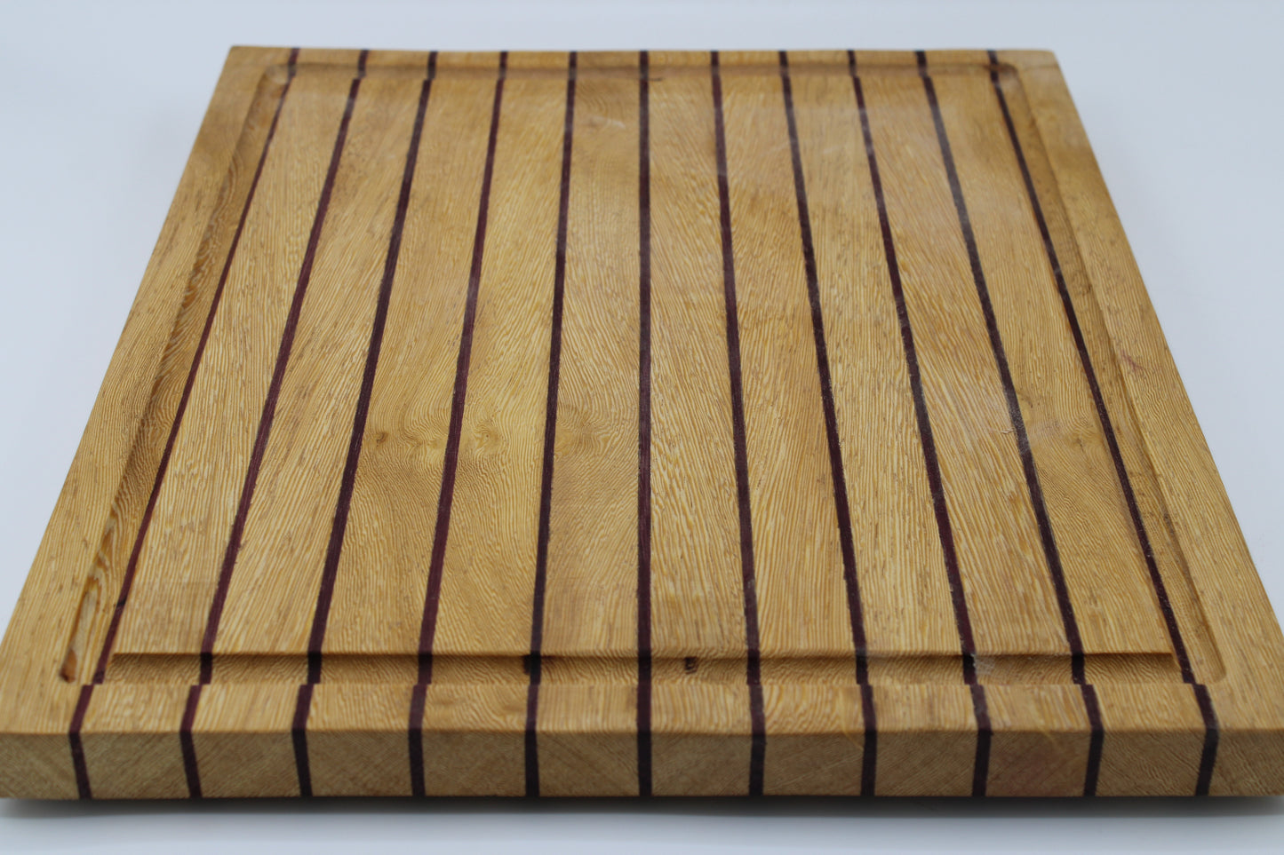 Wood butting board with purple and tan stripes