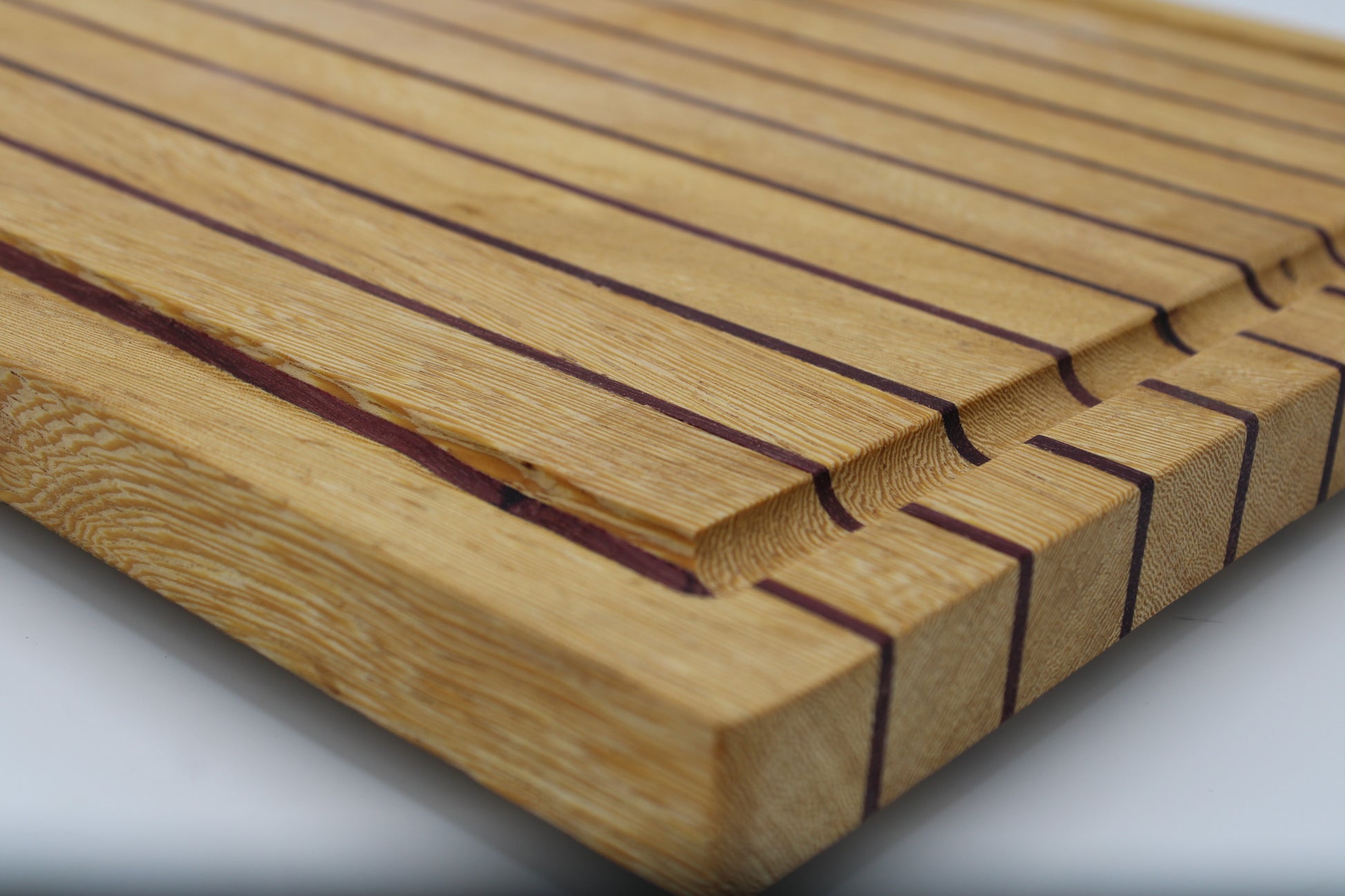 Wood butting board with purple and tan stripes