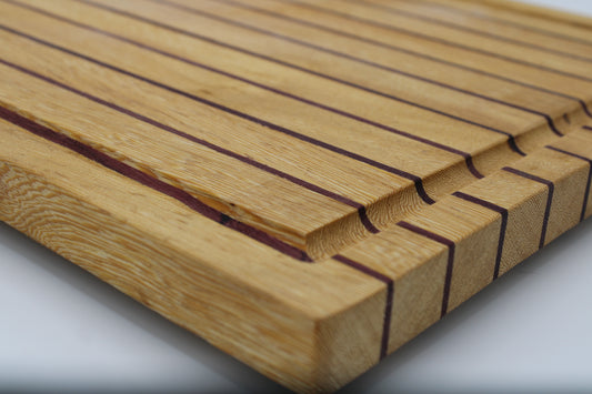Wood butting board with purple and tan stripes