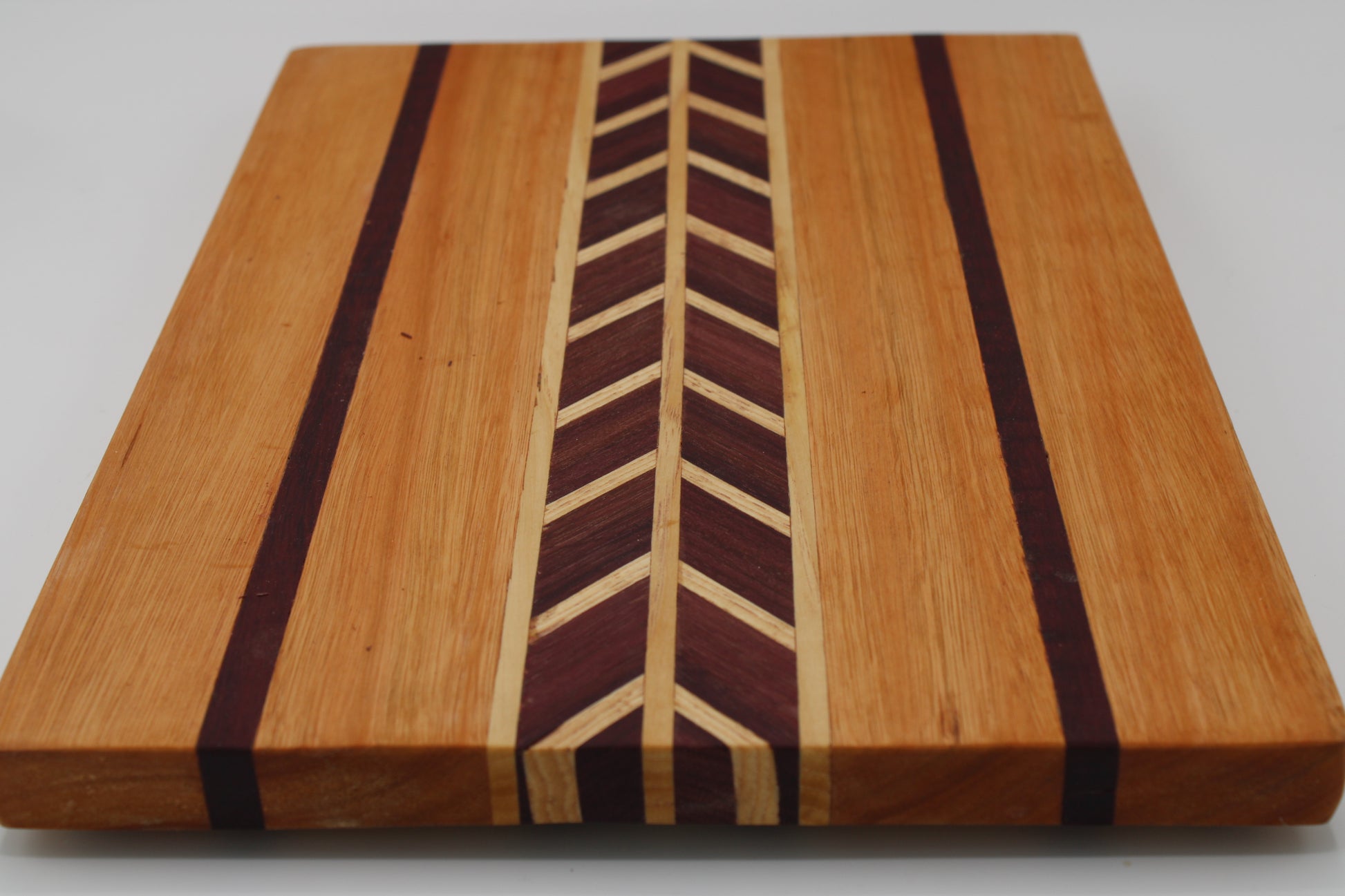 Wood cutting board chevron design and stripes