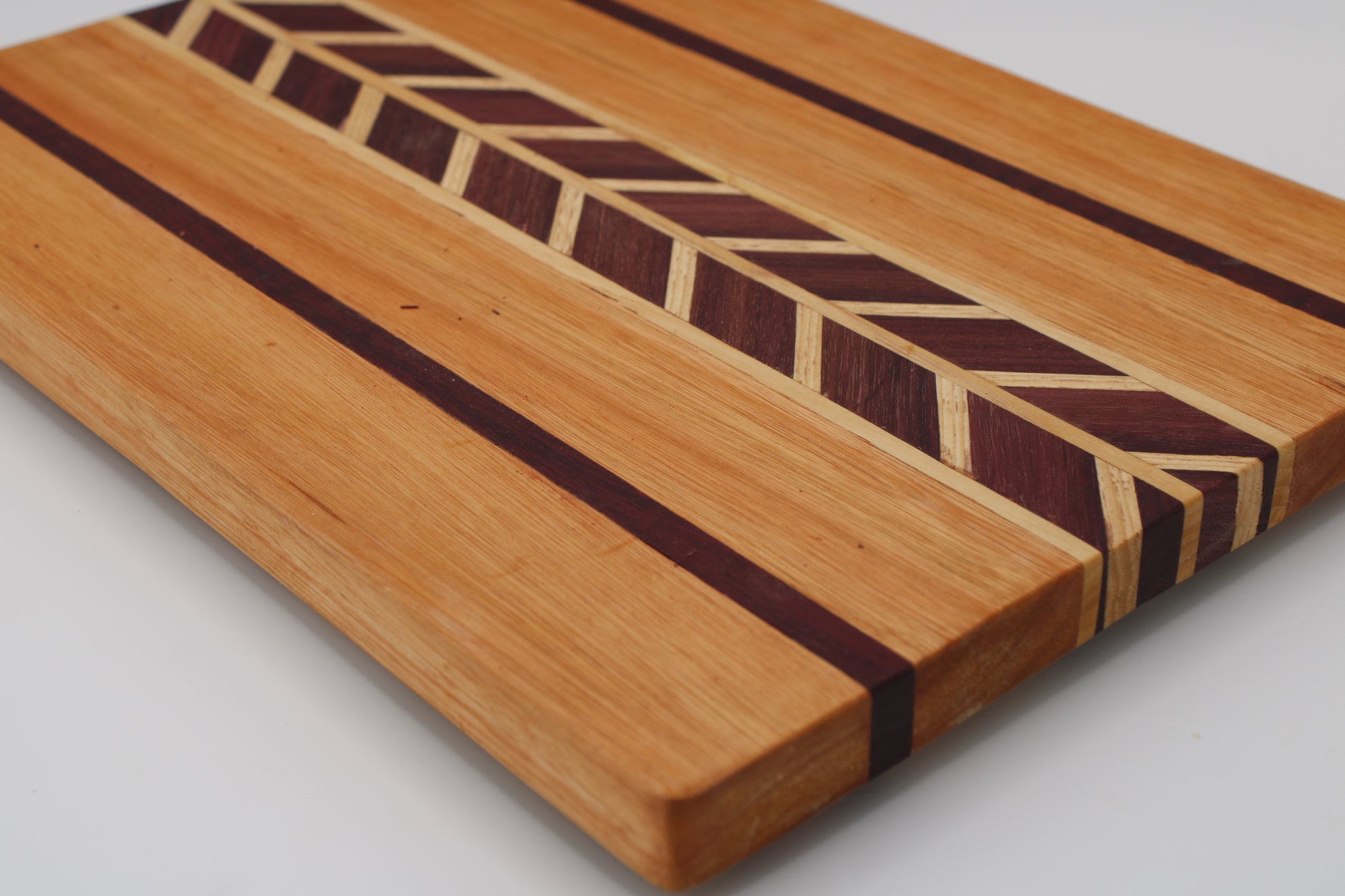 Wood cutting board chevron design and stripes