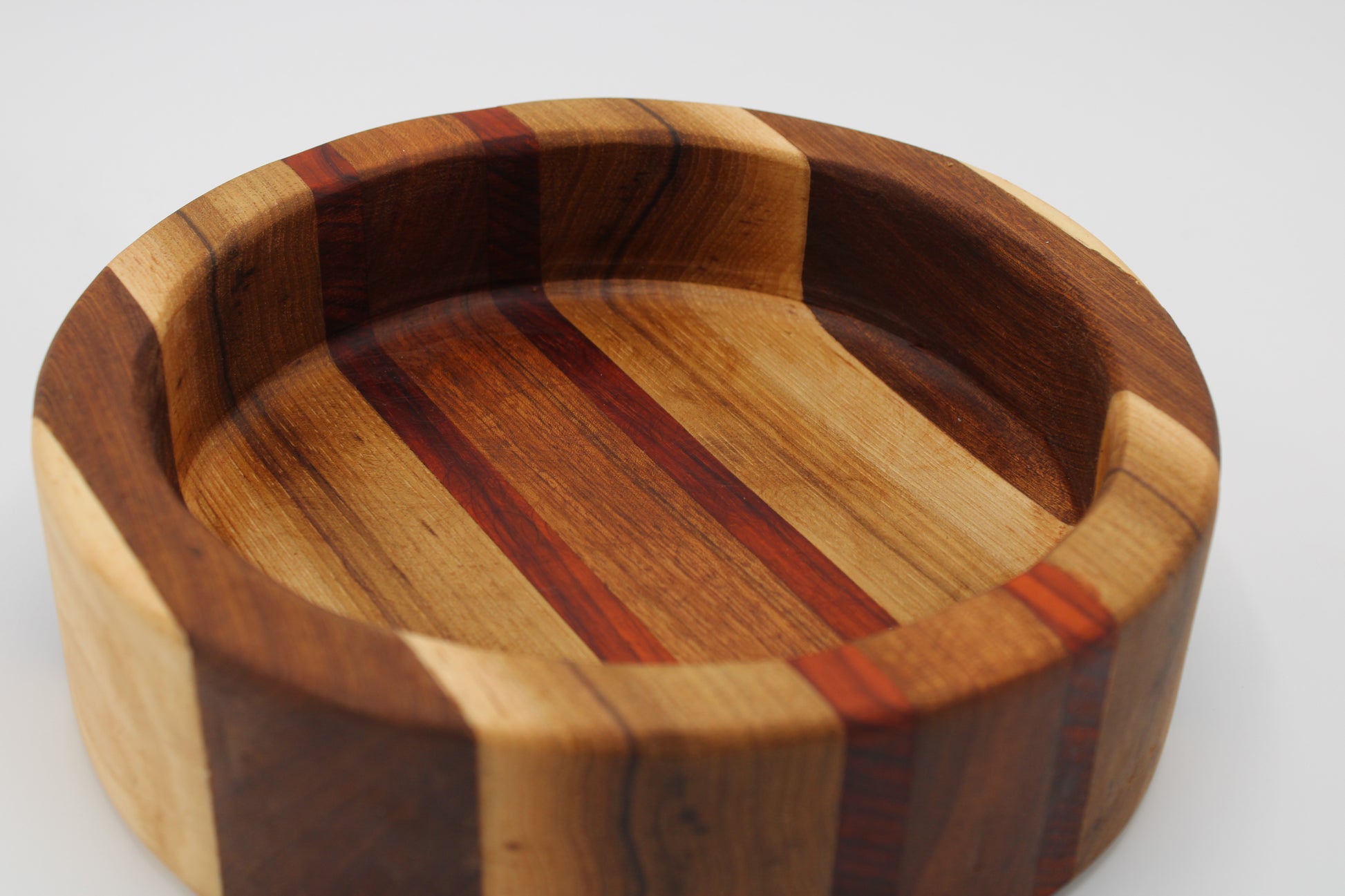 Wood bowl with stripes in brown, tan and red