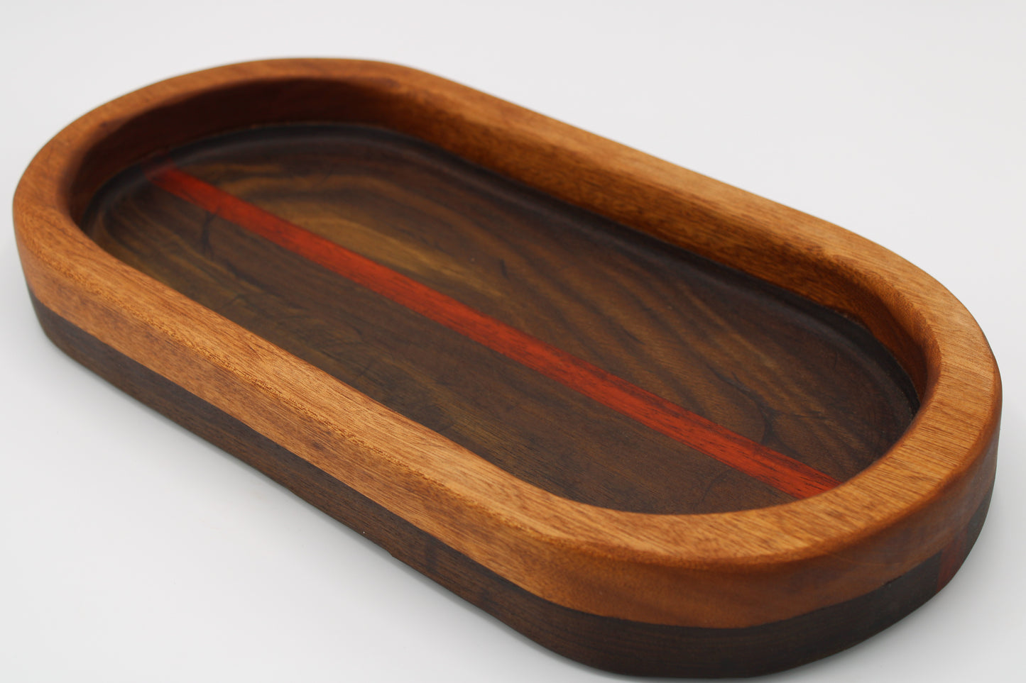 Wood bowl with stripes in brown, tan and  red