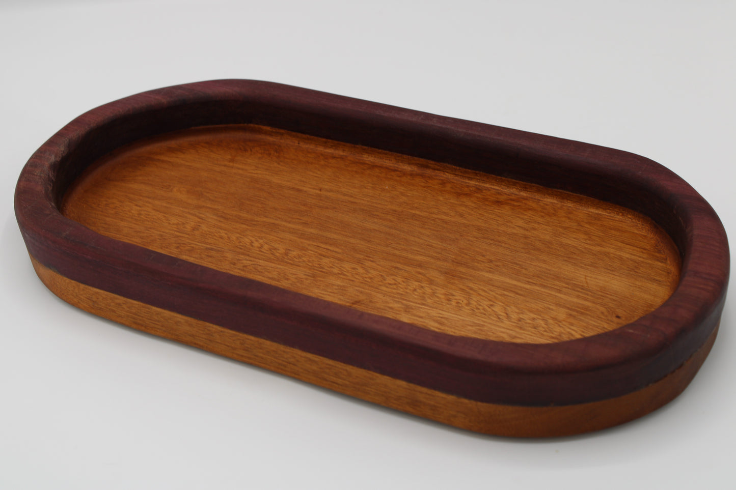 Wood bowl with stripes in reddish brown and purple
