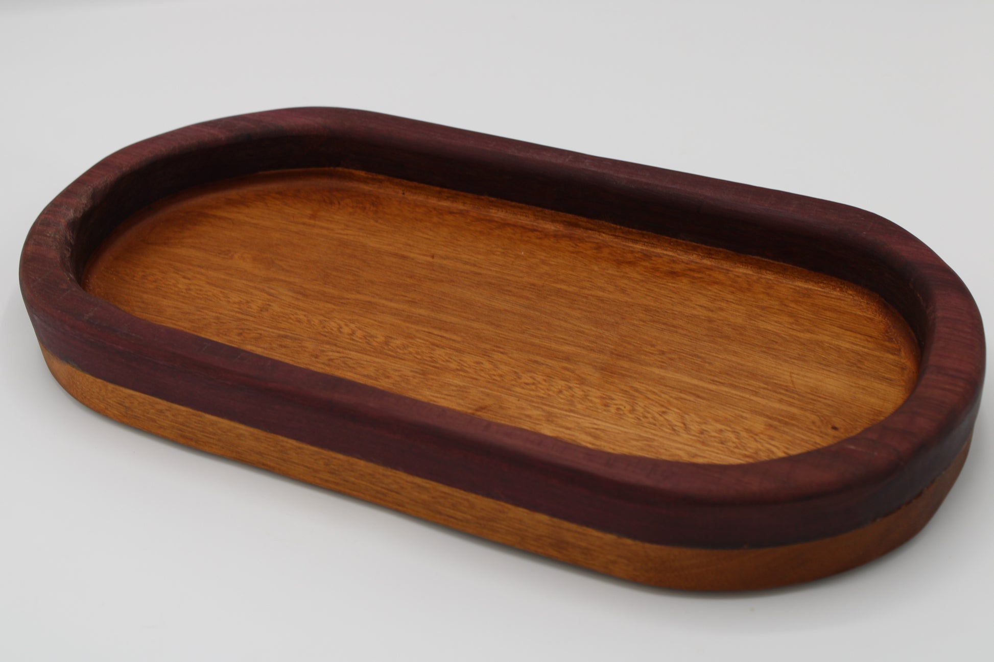 Wood bowl with stripes in reddish brown and purple