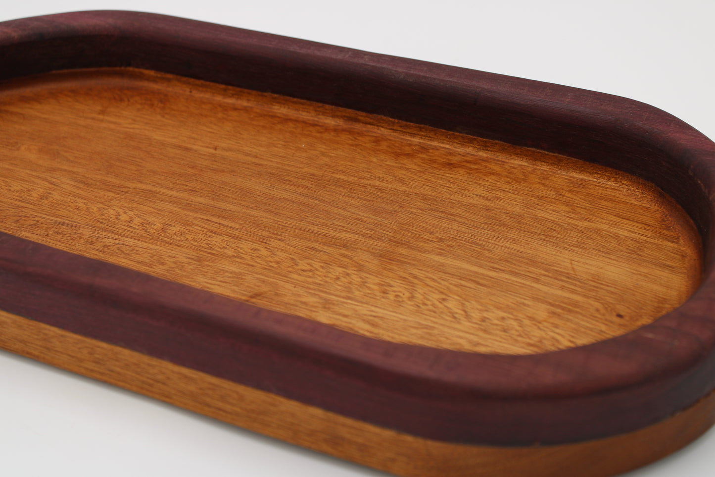 Wood bowl with stripes in reddish brown and purple