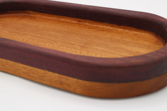 Wood bowl with stripes in reddish brown and purple