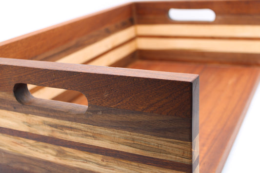 BBQ chopping box with 5 stripes in dark, medium and light brown wood.  Handles on sides.